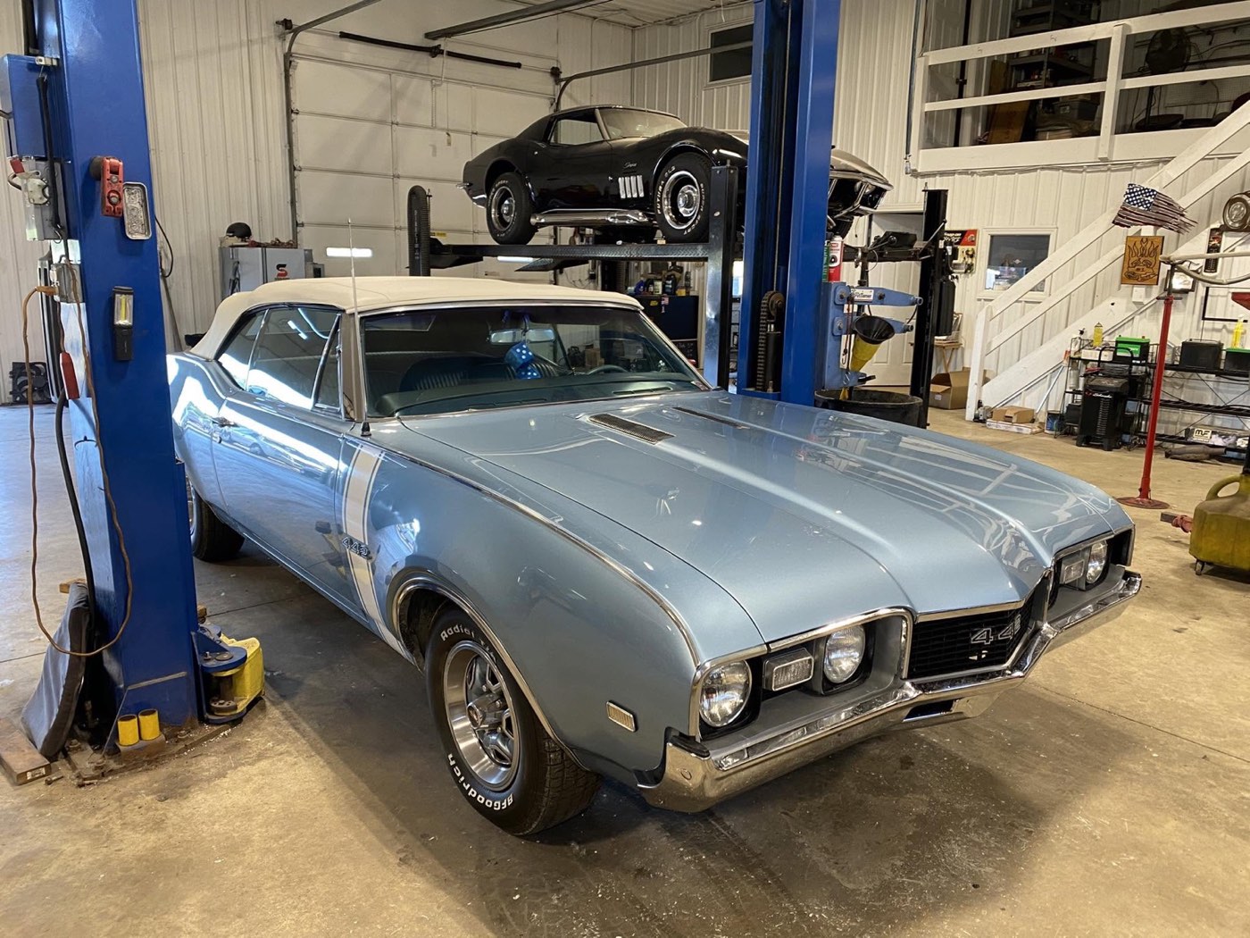 Classic Oldsmobile 442 convertible on a lift at Brady's Auto Service
